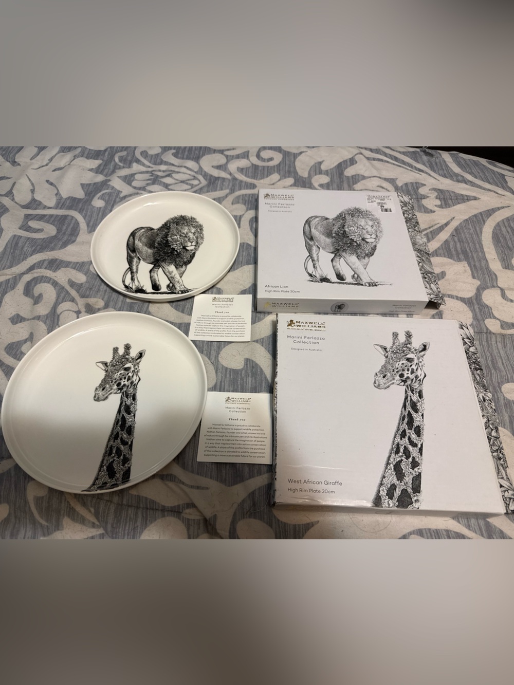 Lion and Giraffe plates. New with box